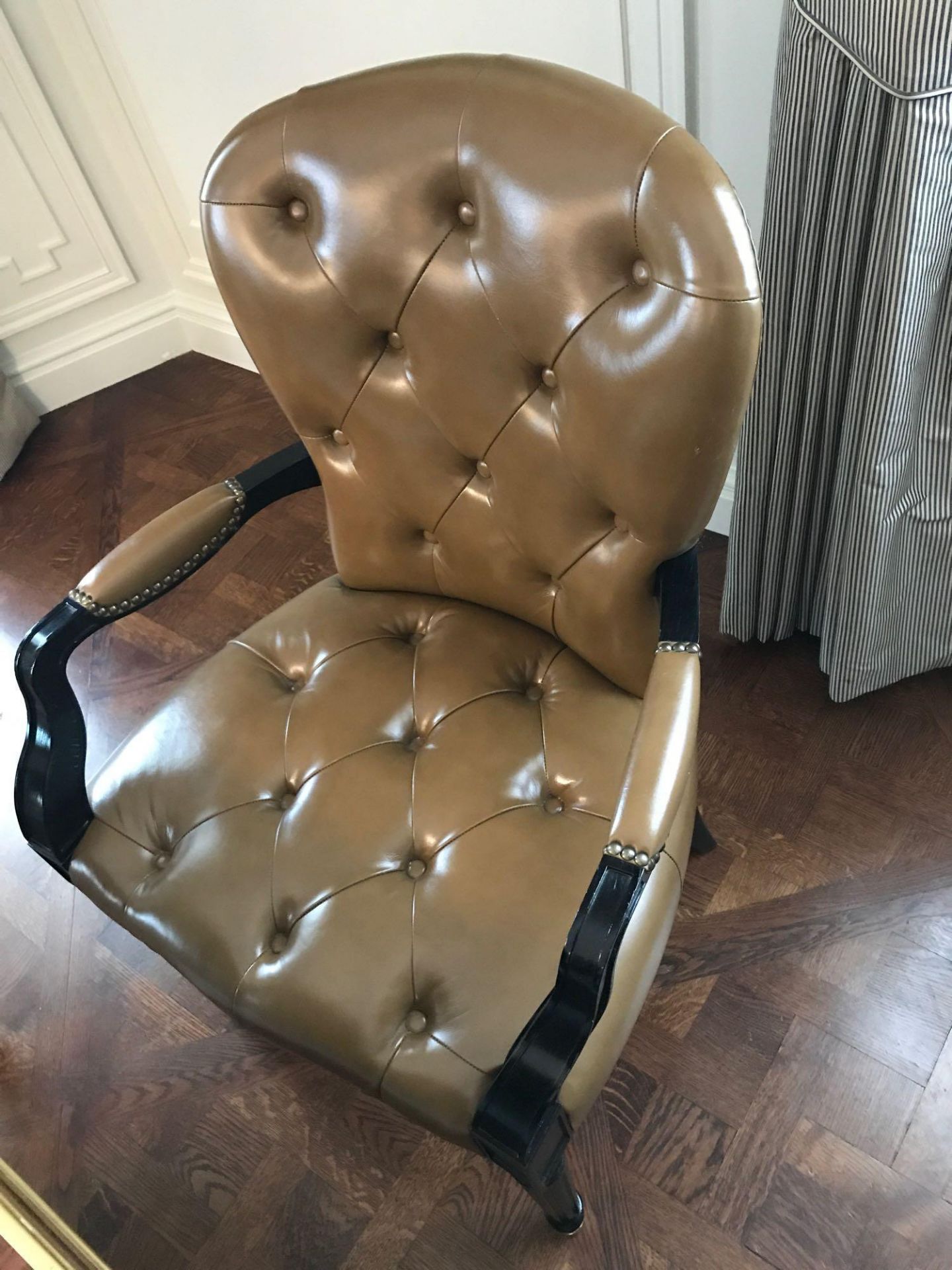 A Leather Tufted Armchair With Chesterfield Style Button And Stud Detail 60 x 63 x 95cm Room 606/7