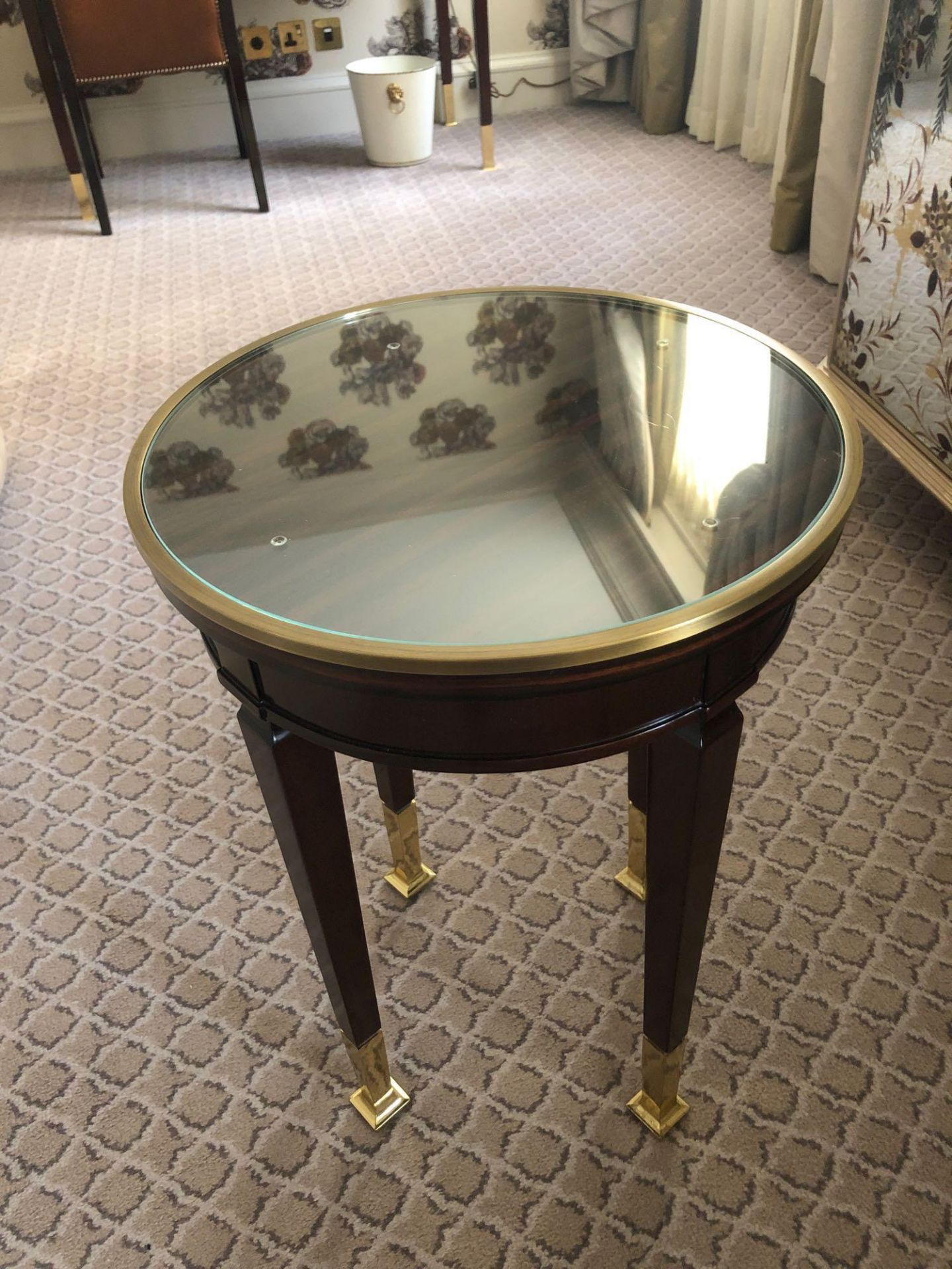 Circular Side Table With Antiqued Plate Top And Brass Trim Mounted On Tapering Legs With Brass