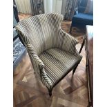 A Modern Wing Back Chair Upholstered In Striped  With Pin Stud Detail On Dark Solid Wood Frame