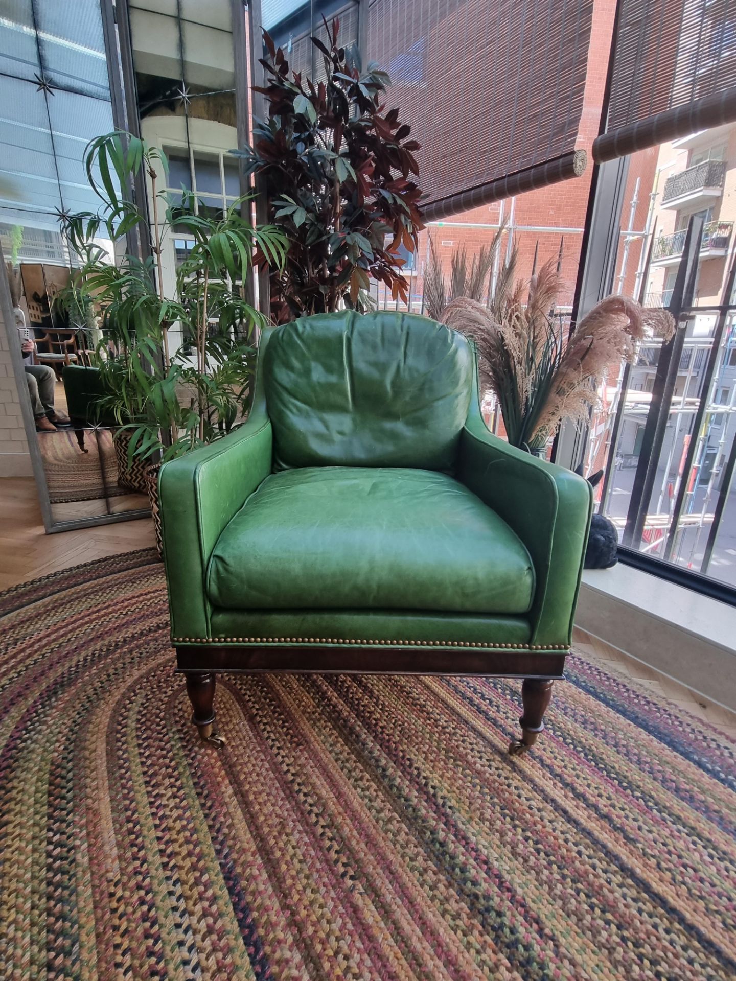 A  Green Leather upholstered vintage armchair on castor front legs reupholstered in a racing green - Image 2 of 4