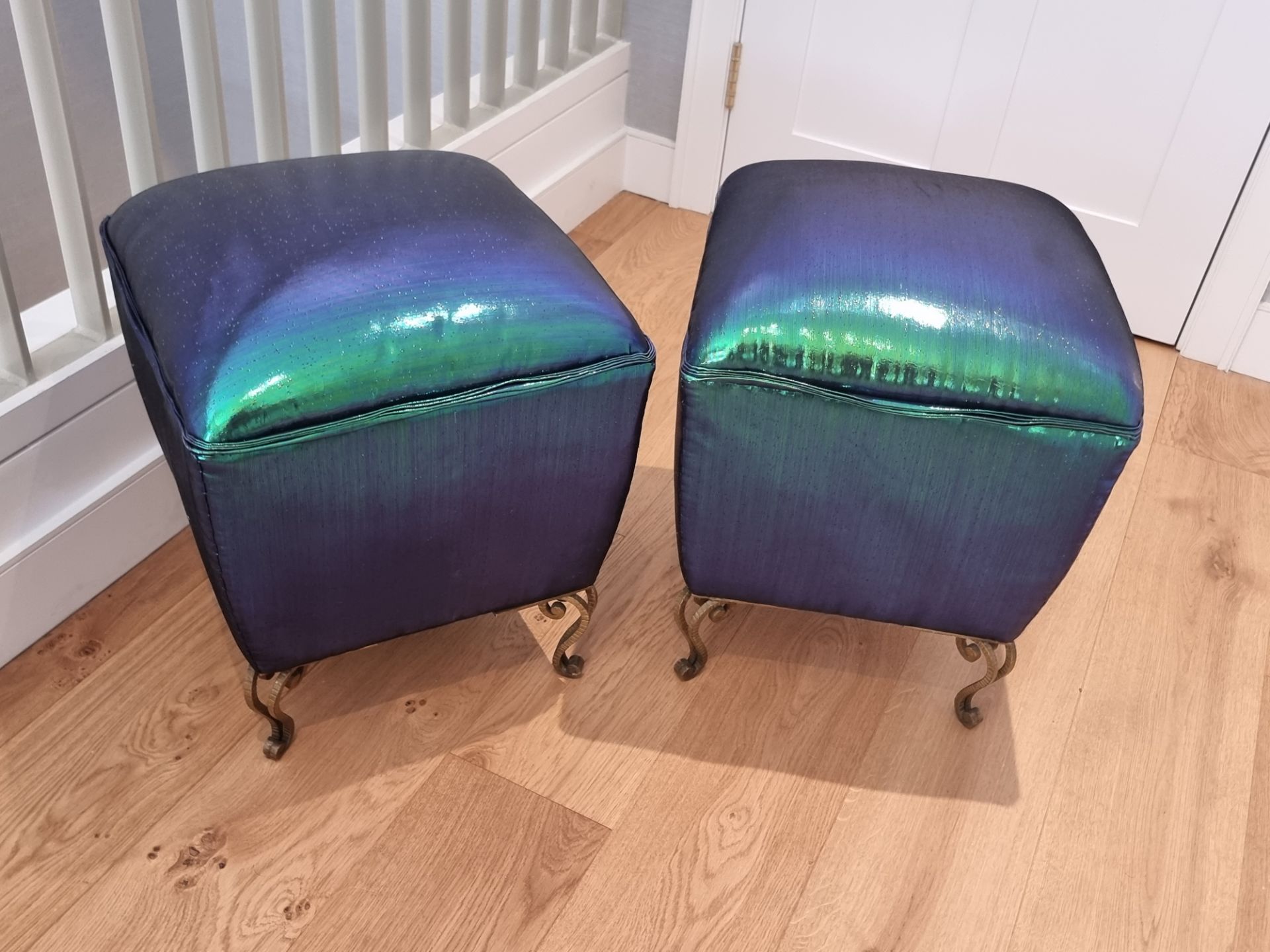 A pair of Italian stools by Pier Luigi Colli, re imagined by Studio Bucchi in iridescent fabric