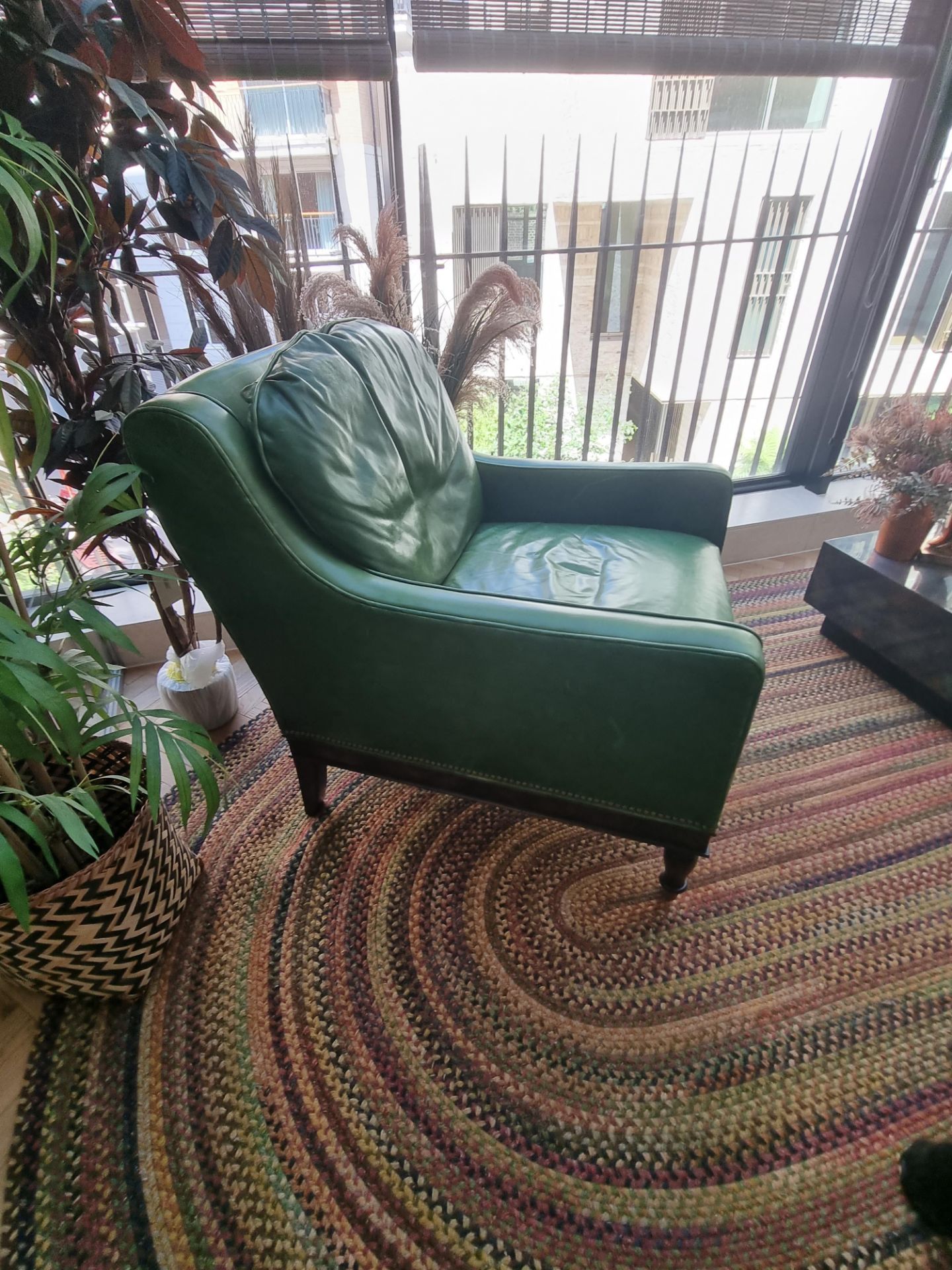 A  Green Leather upholstered vintage armchair on castor front legs reupholstered in a racing green - Image 3 of 4