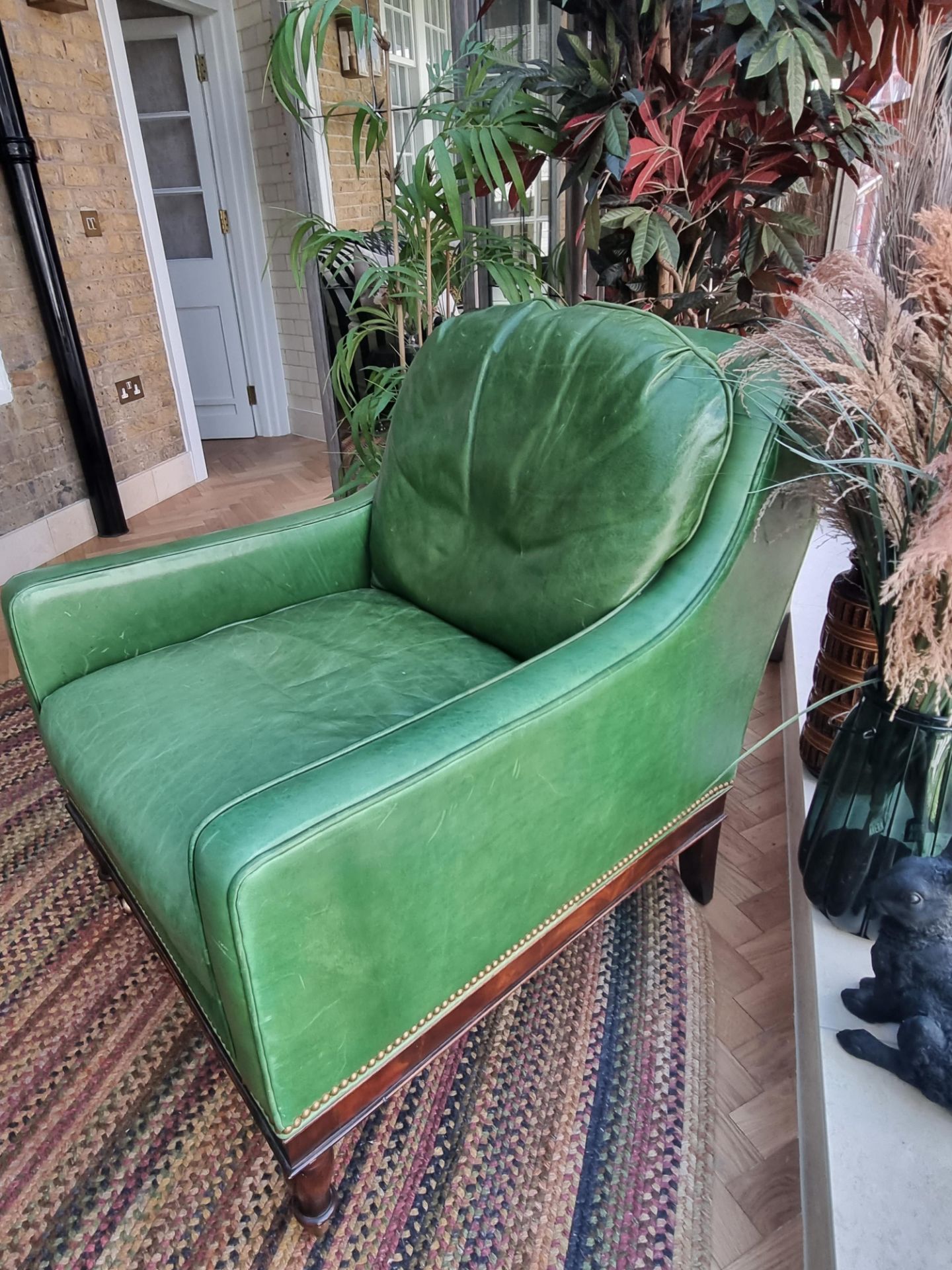 A  Green Leather upholstered vintage armchair on castor front legs reupholstered in a racing green - Image 4 of 4