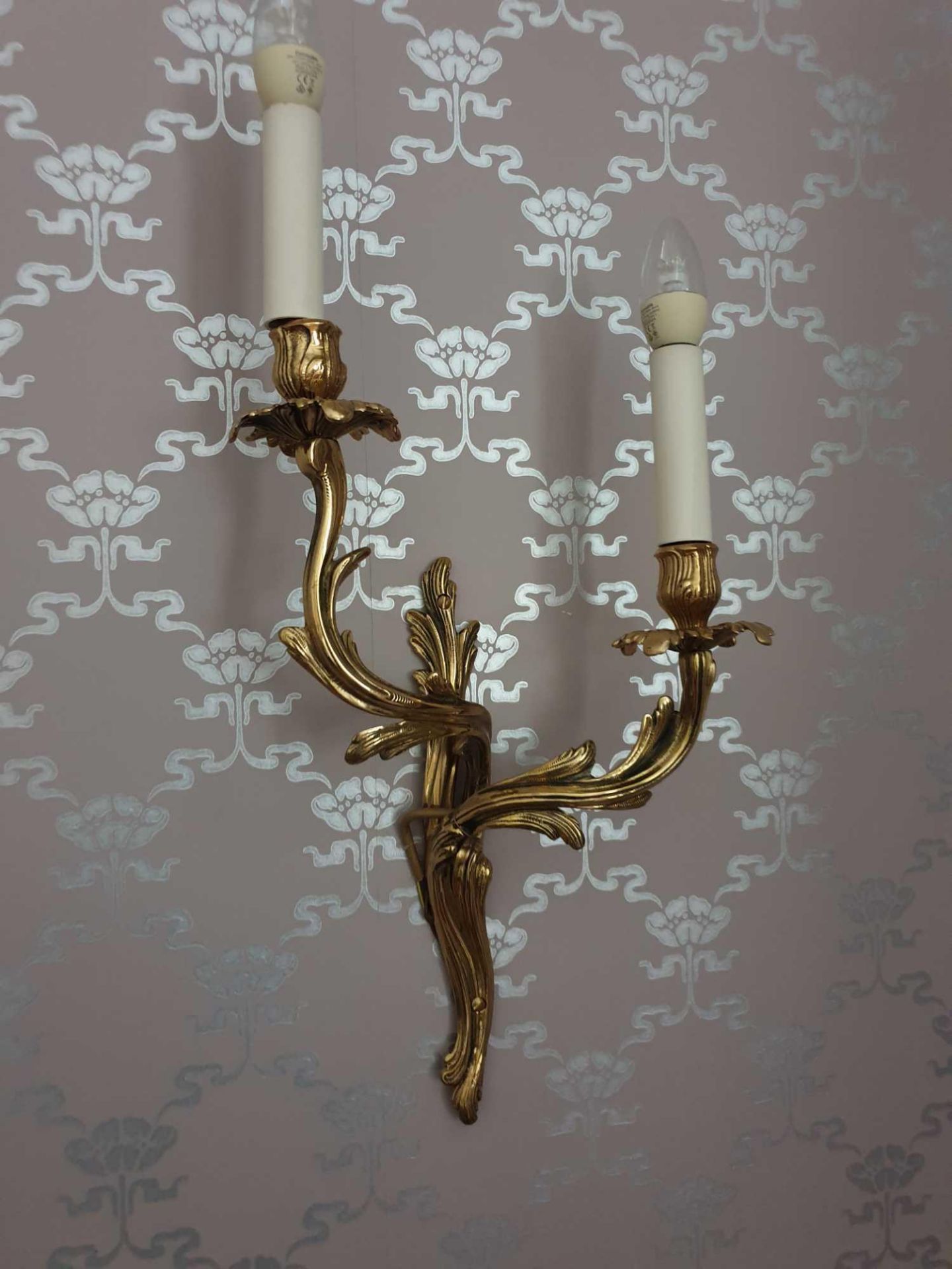 A Pair Of Louis XV Style Wall Appliques In Gilt Bronze With Two Candles Agrafe Decor On Which Are
