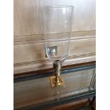 A Pair Of Candle Holders With Tall Glass Shades And Brass Featuring Ornamental Design 42cm (Room 710
