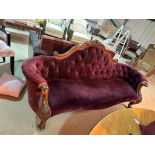 Beautiful carved wooden sofa upholstered in puple velvet