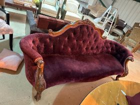 Beautiful carved wooden sofa upholstered in puple velvet