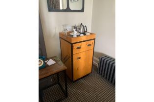Mini Bar Cabinet Wooden With Metal Accent And Cup Handles.