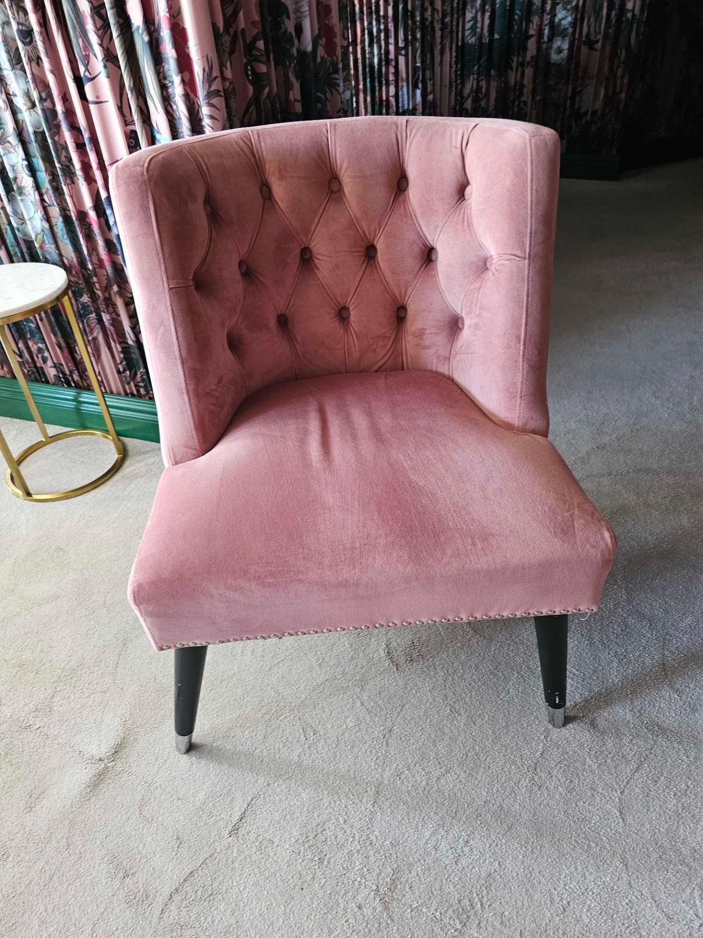 A single contemporary blush pink velvet lounge chair 64 x 62 x 83cm