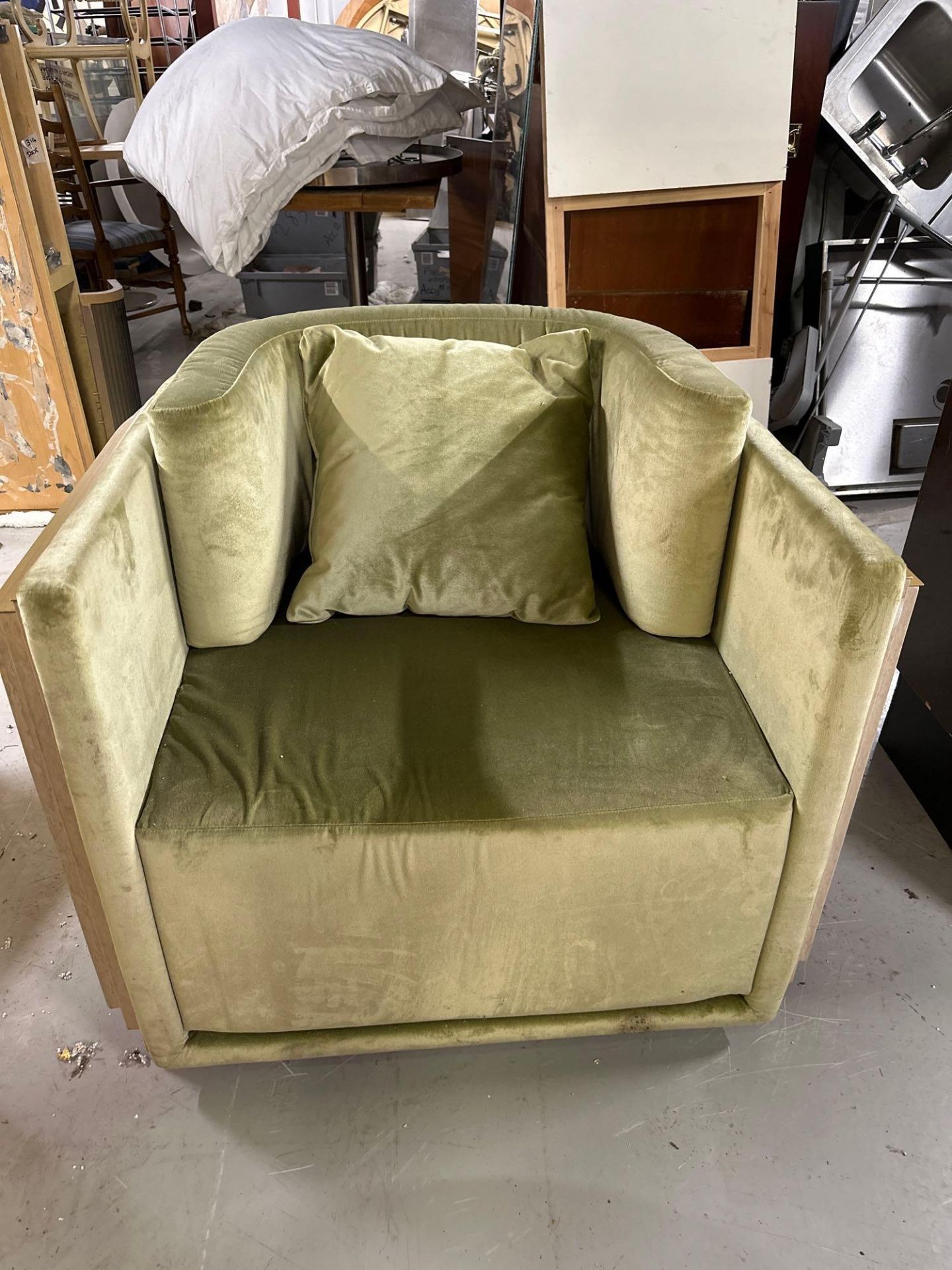 An Art Deco Inspired Armchair With Wrapped Wooden Detail To Back And Sides, Upholstered In Sage
