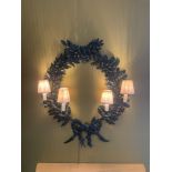 A Four Candle Wall Light Pendant In A Wreath Form Proportioned Hand Forged And Patinated Metalwork