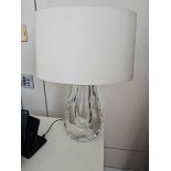 A pair of Heathfield and Co Anya Table Lamps with Shade Casting delicate reflections through its