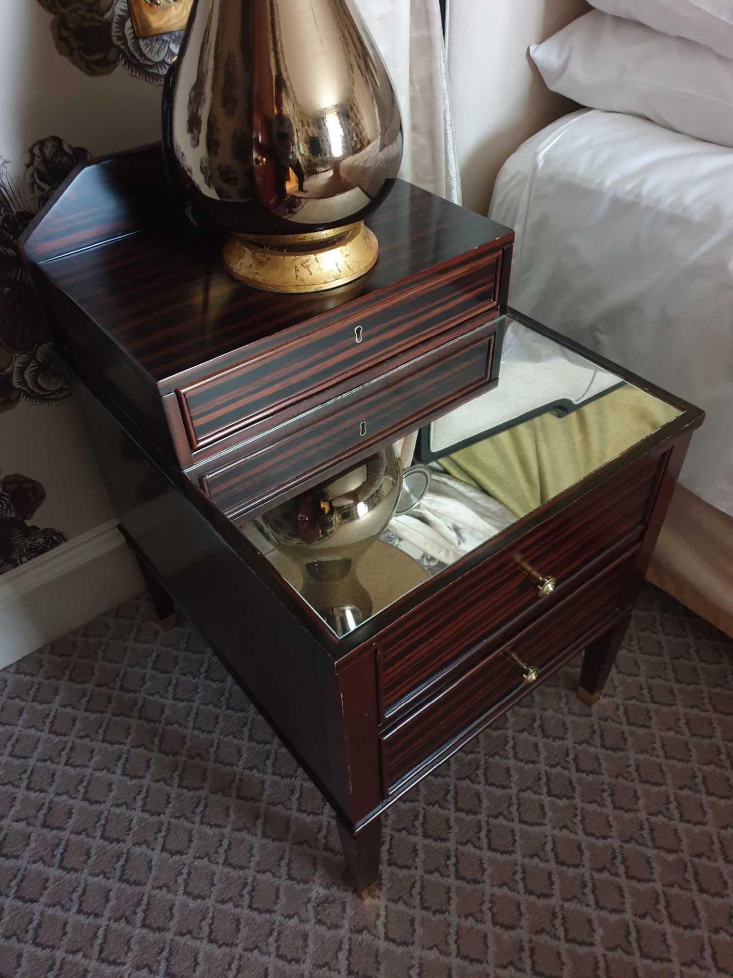 A Pair Of Two Tier Bedside Nightstands With Antiqued Plate Top With Storage Compartments Mounted