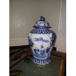 A Maitland Smith blue and white temple jar with foo dog lid