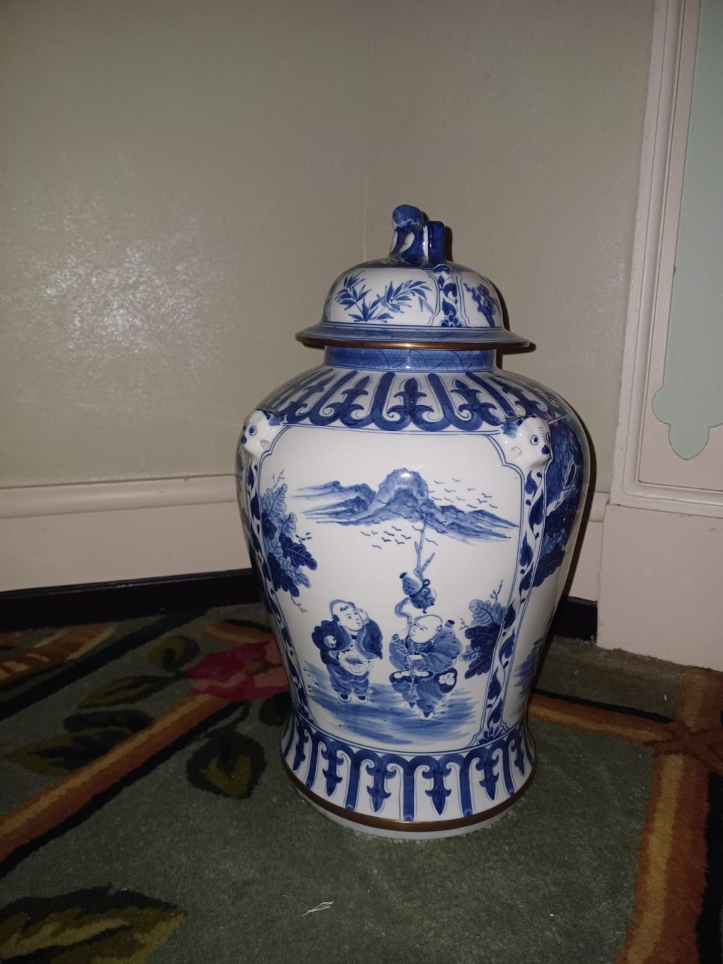 A Maitland Smith blue and white temple jar with foo dog lid