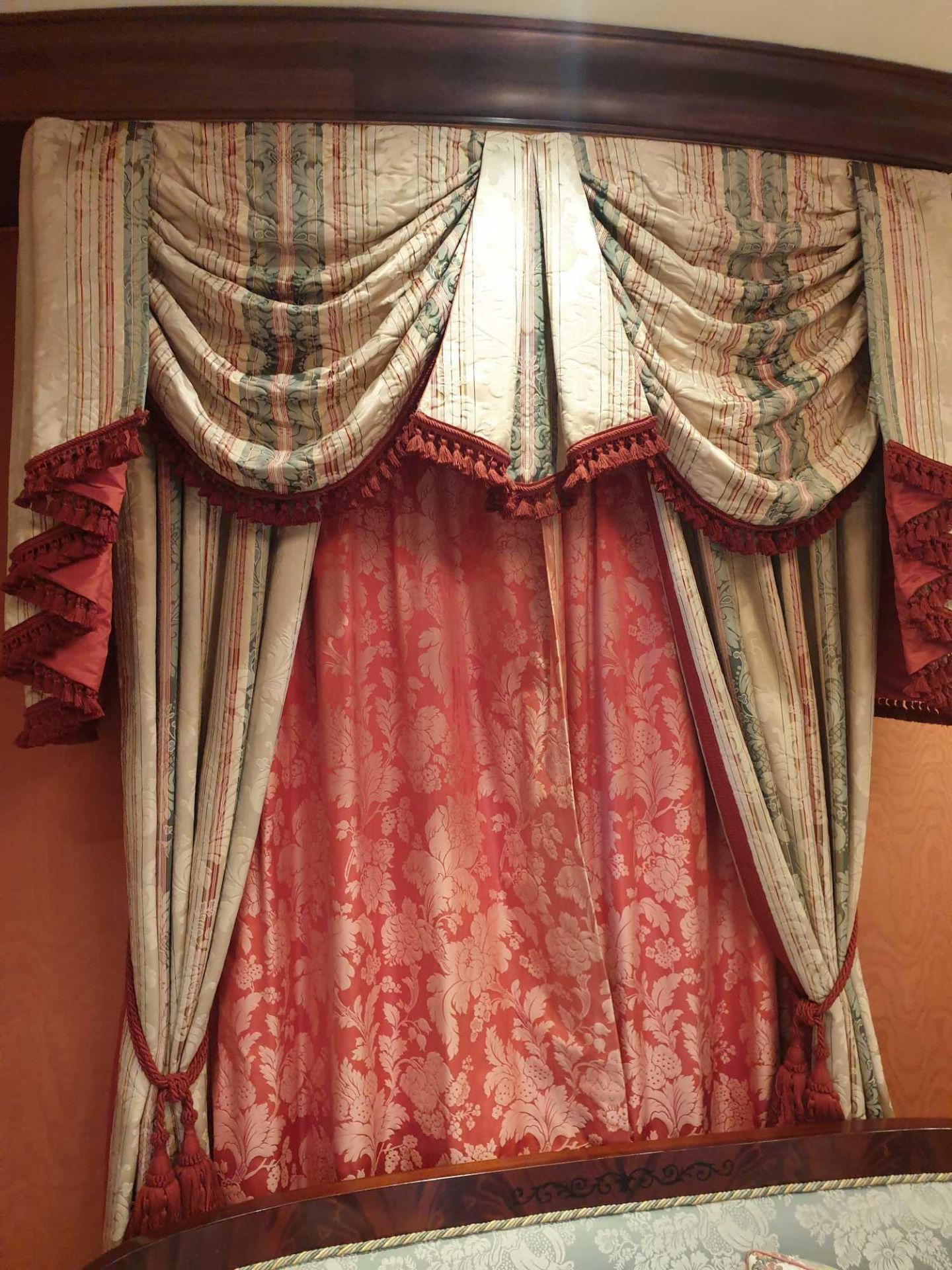 A Pair Of Cream Silk Drapes With Swags And Jabots In Gold Green And Pink Detail With Tassels And