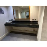 A black stone floating vanity shelf 55cm x 220cm ( Location: mens locker room )