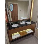A stone top black double basin vanity unit with Vitra porcelain basins and Hansgrohe Blend Single