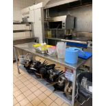 Contents of shelf as found. To include large quantity of commercial cooking equipment and