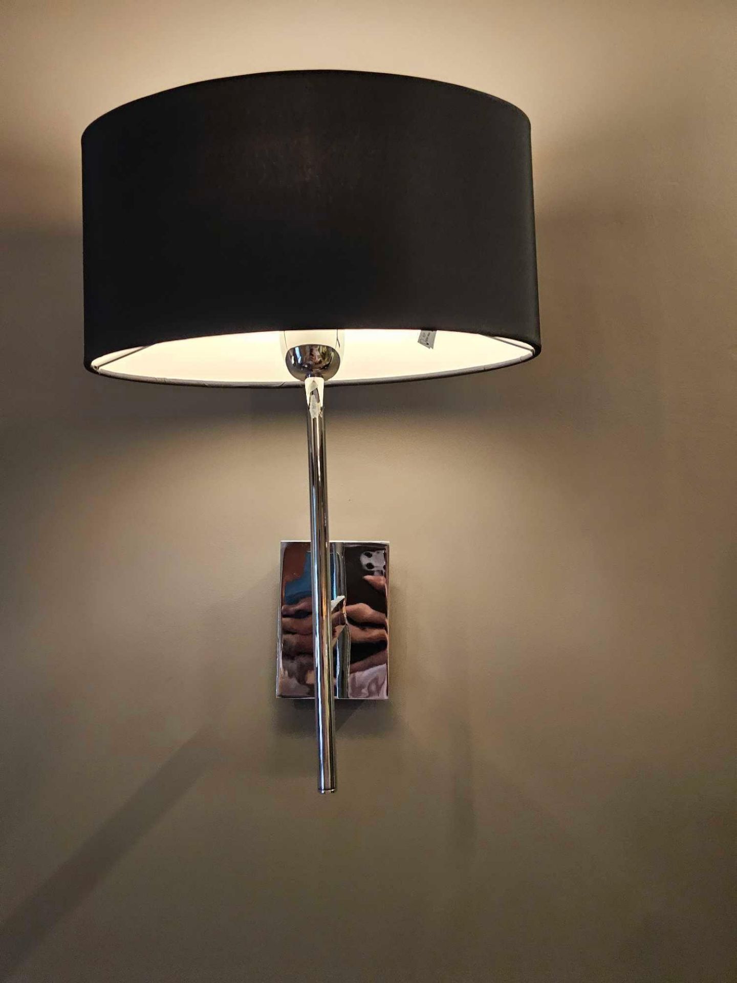 A pair of wall sconces with shades ( Location : 210)