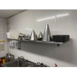 Wall mounted stainless steel shelf ( Location: Main Kitchen )