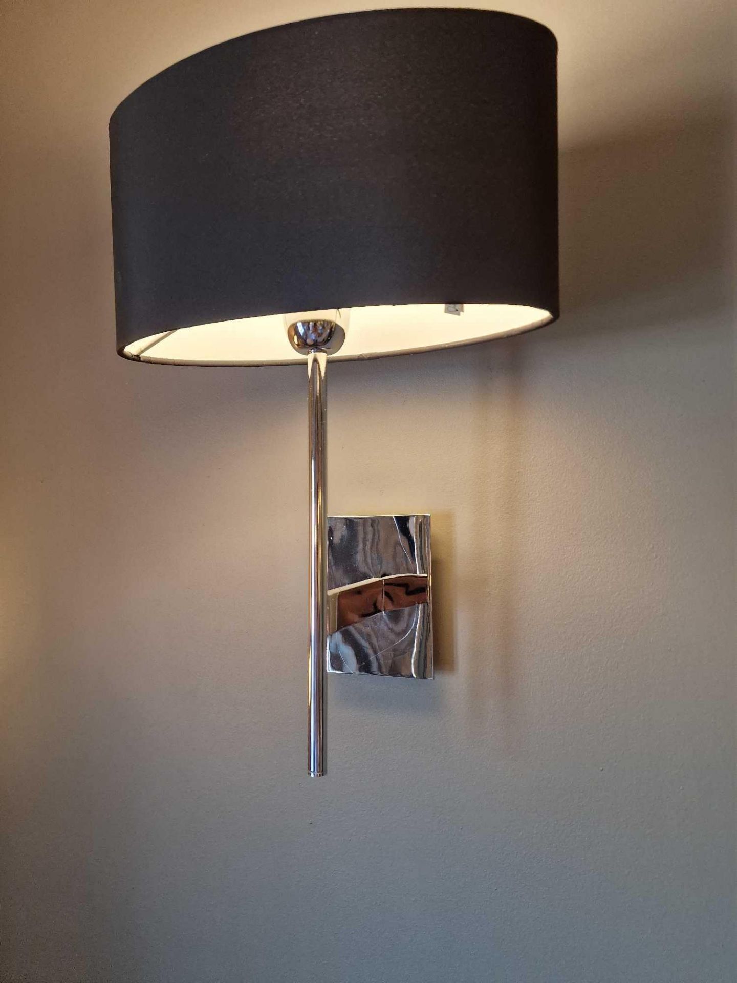 A pair of wall sconces with shades ( Location : 232)