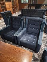 A pair of Design 79 contemporary wing back upholstered blue velvet with buttons chair 86cm pitch x