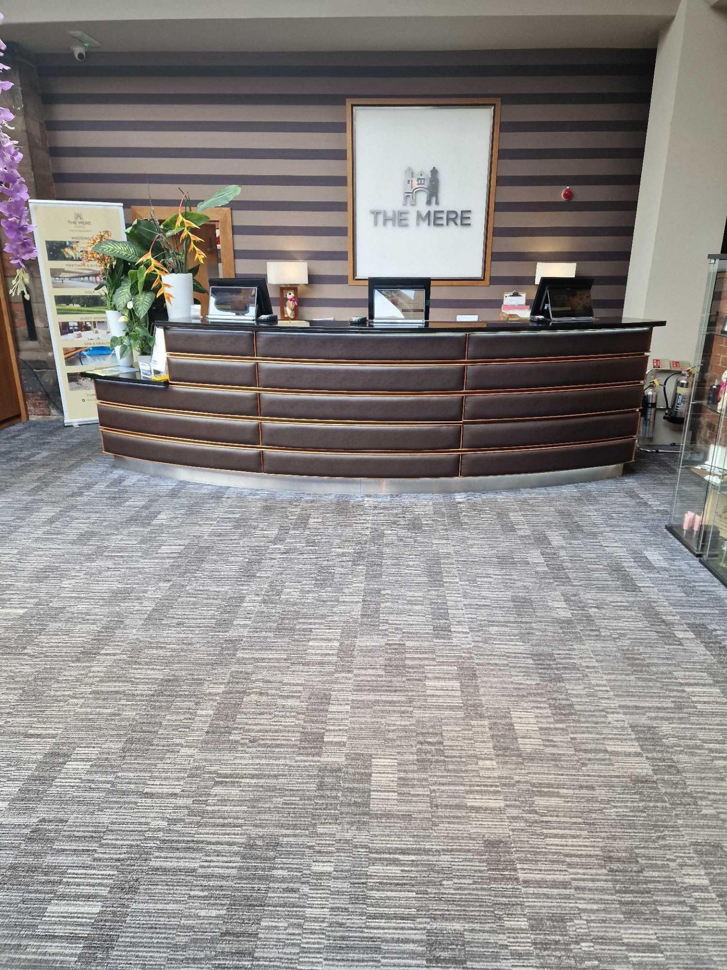 Reception counter curved form wood structure with black stone top 50cm deep with faux leather