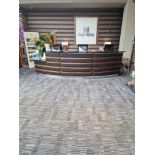 Reception counter curved form wood structure with black stone top 50cm deep with faux leather