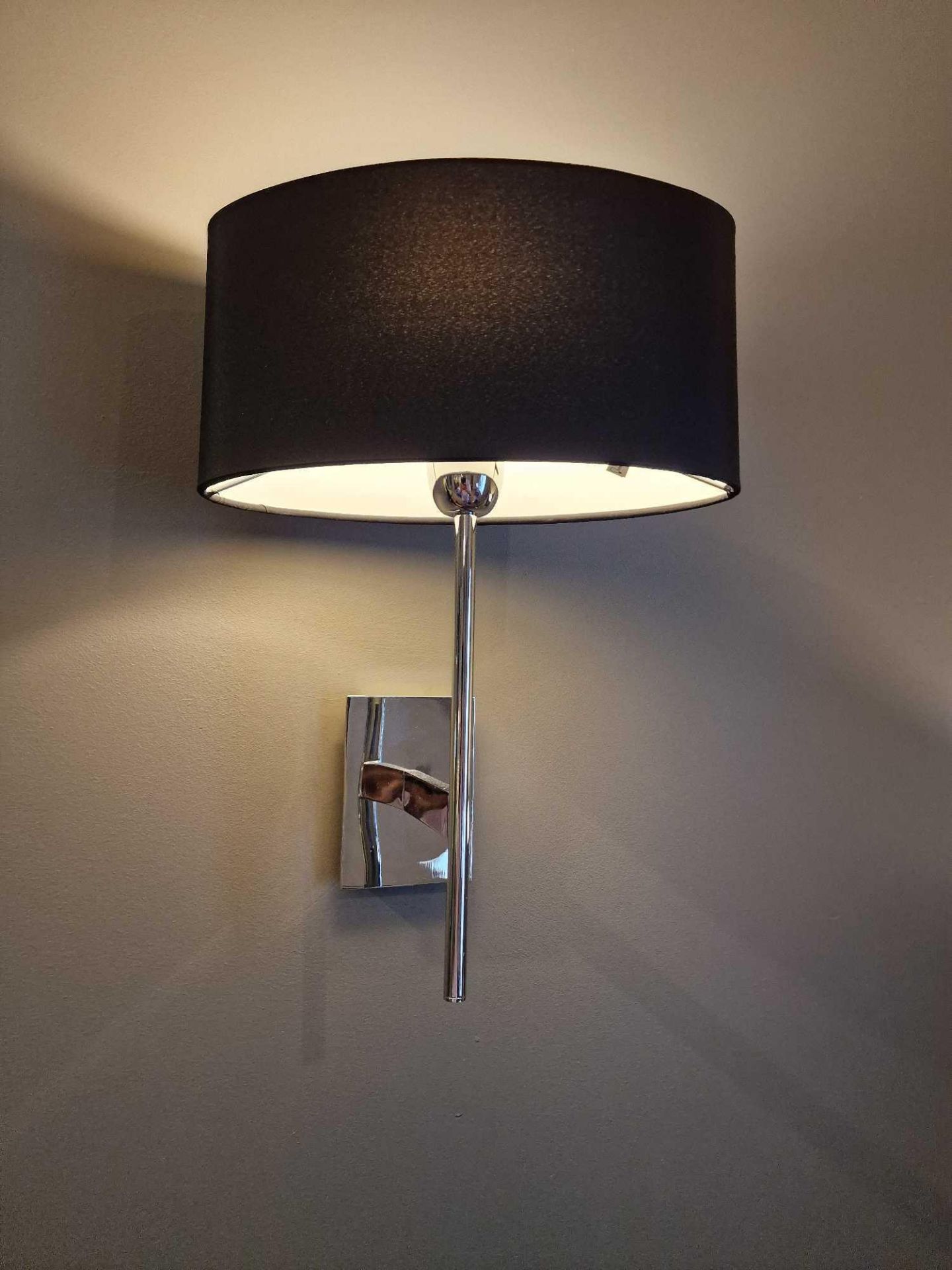A pair of wall sconces with shades ( Location : 229)