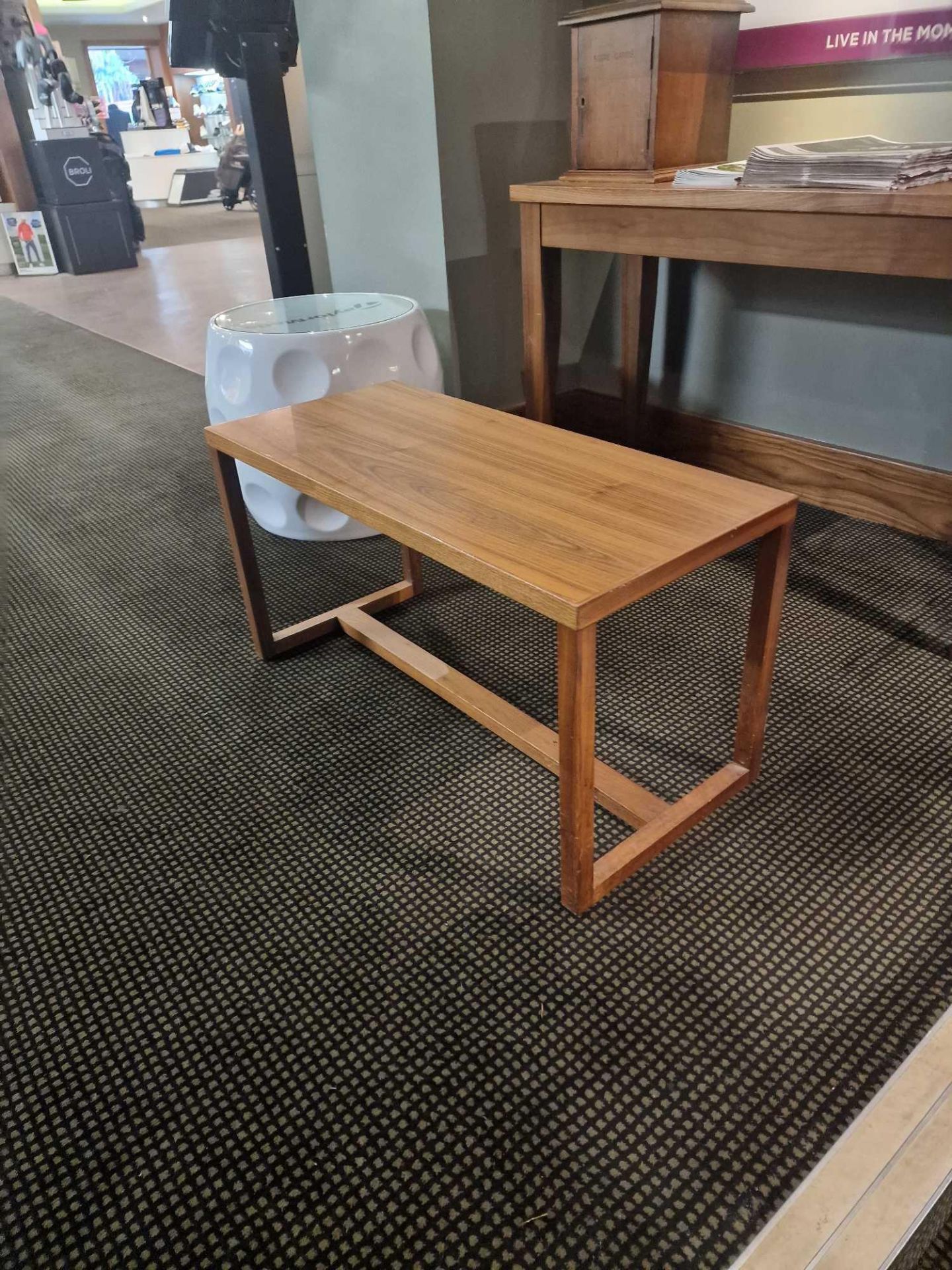 Small low level wooden table 90 x 40 x 47cm ( Location: Club Lounge)