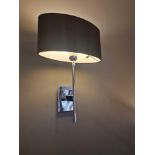 A pair of wall sconces with shades ( Location : 205)