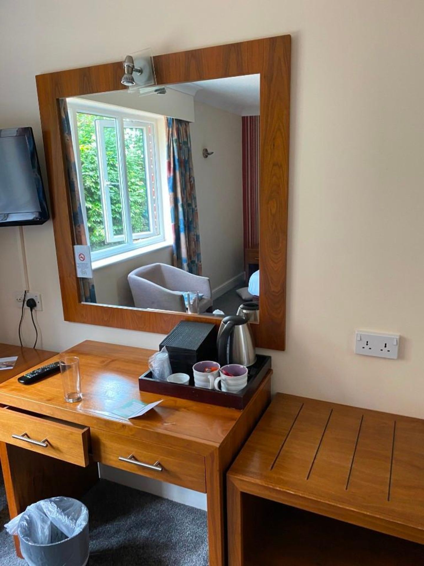 Contents of guest bedroom number 19 at the Brookfield Hotel. Darkwood bedroom desk with 3 drawers