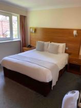 Contents of guest bedroom number 41 at the Brookfield Hotel. Darkwood bedroom desk with 3 drawers