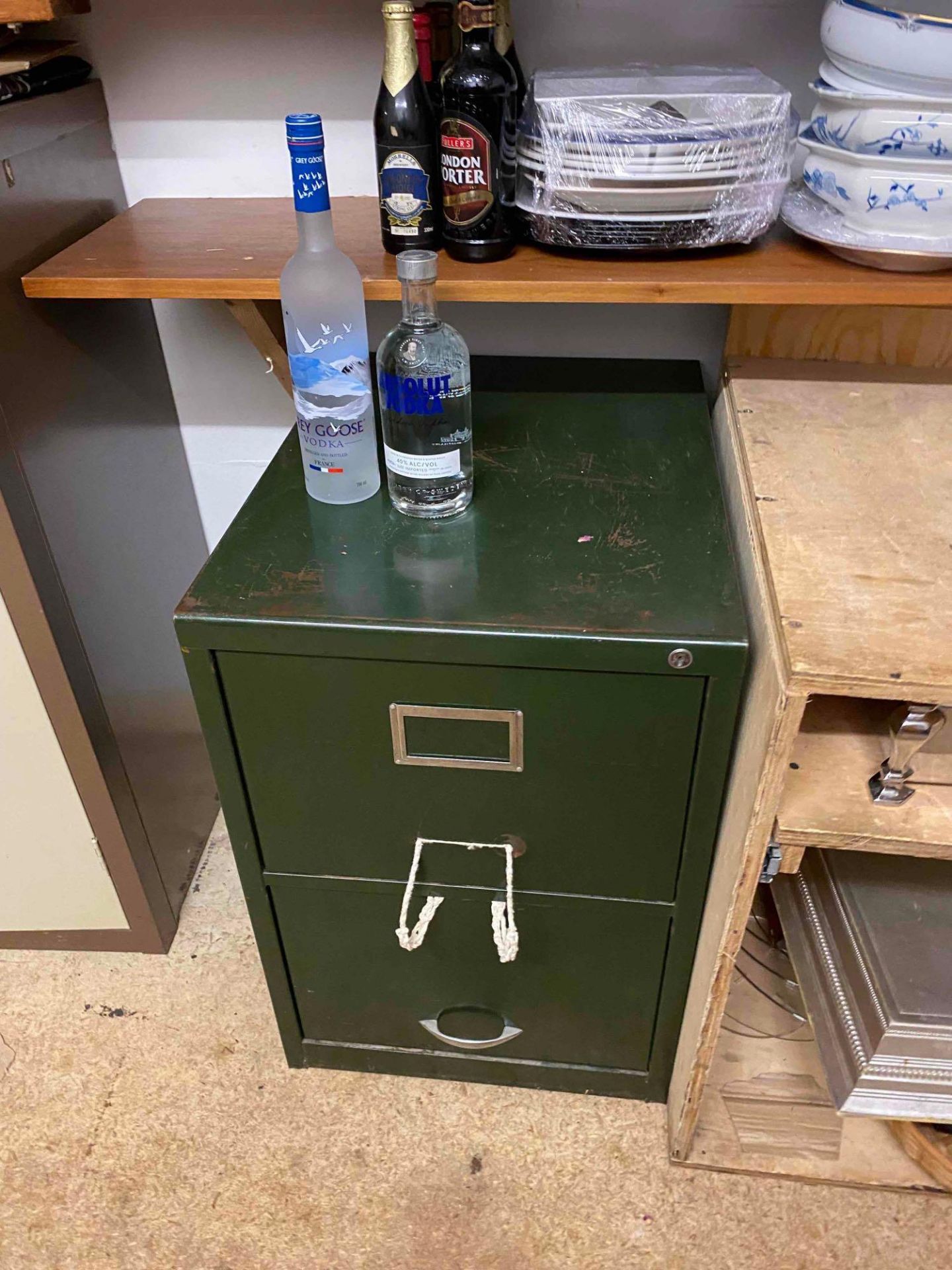 Green vintage two drawer filing cabinet as found.