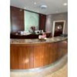 Reception and bar counter consisting of stone top and back bar equipment, less refrigeration.
