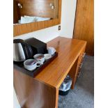 Contents of guest bedroom number 4 at the Brookfield Hotel. Darkwood bedroom desk with 3 drawers and