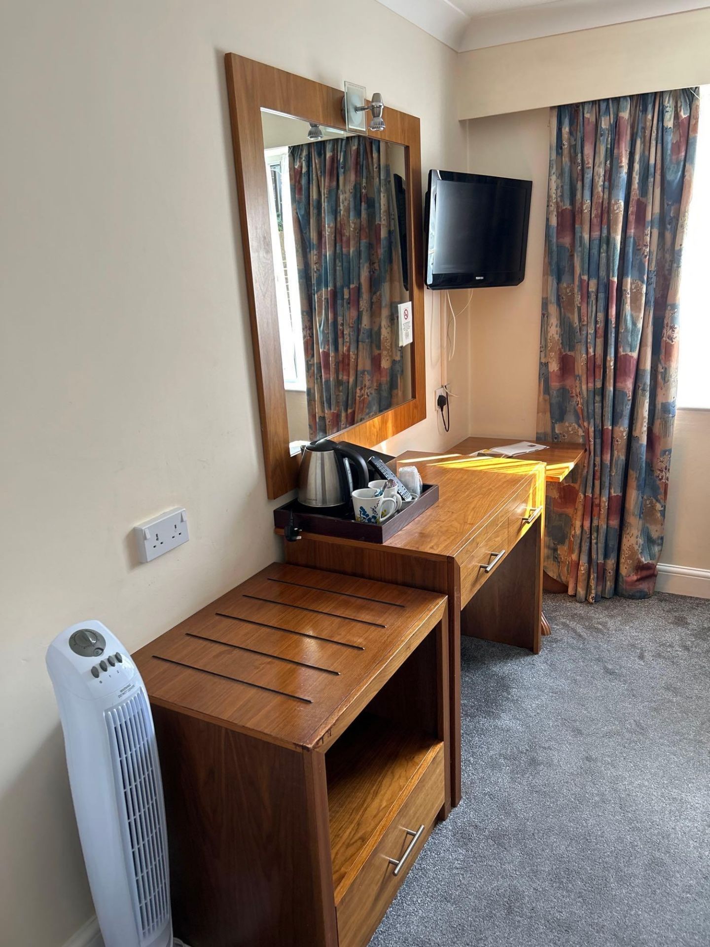 Contents of guest bedroom number 30 at the Brookfield Hotel. Darkwood bedroom desk with 3 drawers