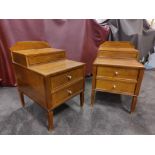 A Pair Of Two Tier Bedside Nightstands With Plate Top With Storage Compartments Mounted On Tapered