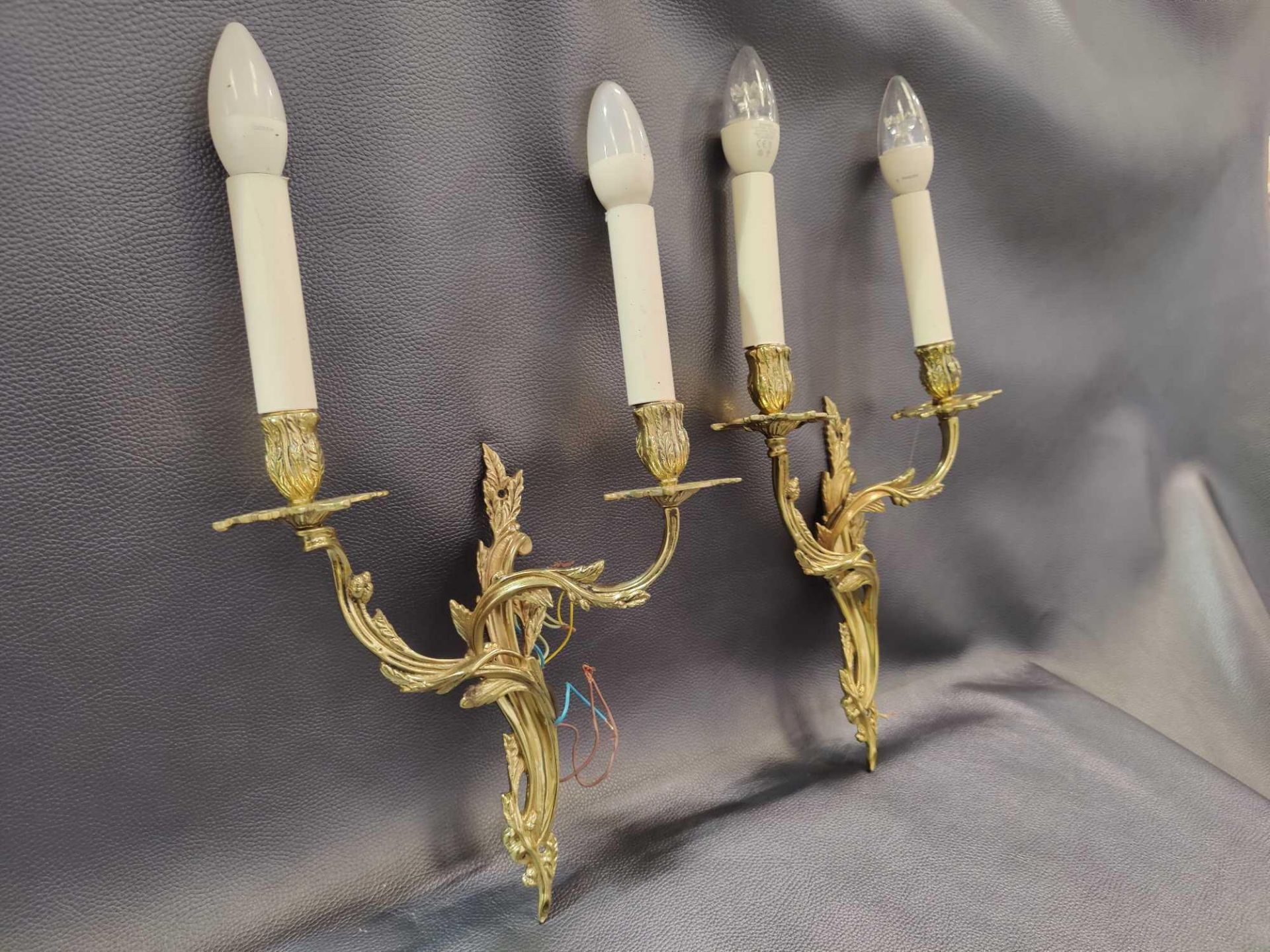 A Pair Of Rococo Style Wall Appliques In Gilt Bronze With Two Candles Agrafe Decor On Which Are