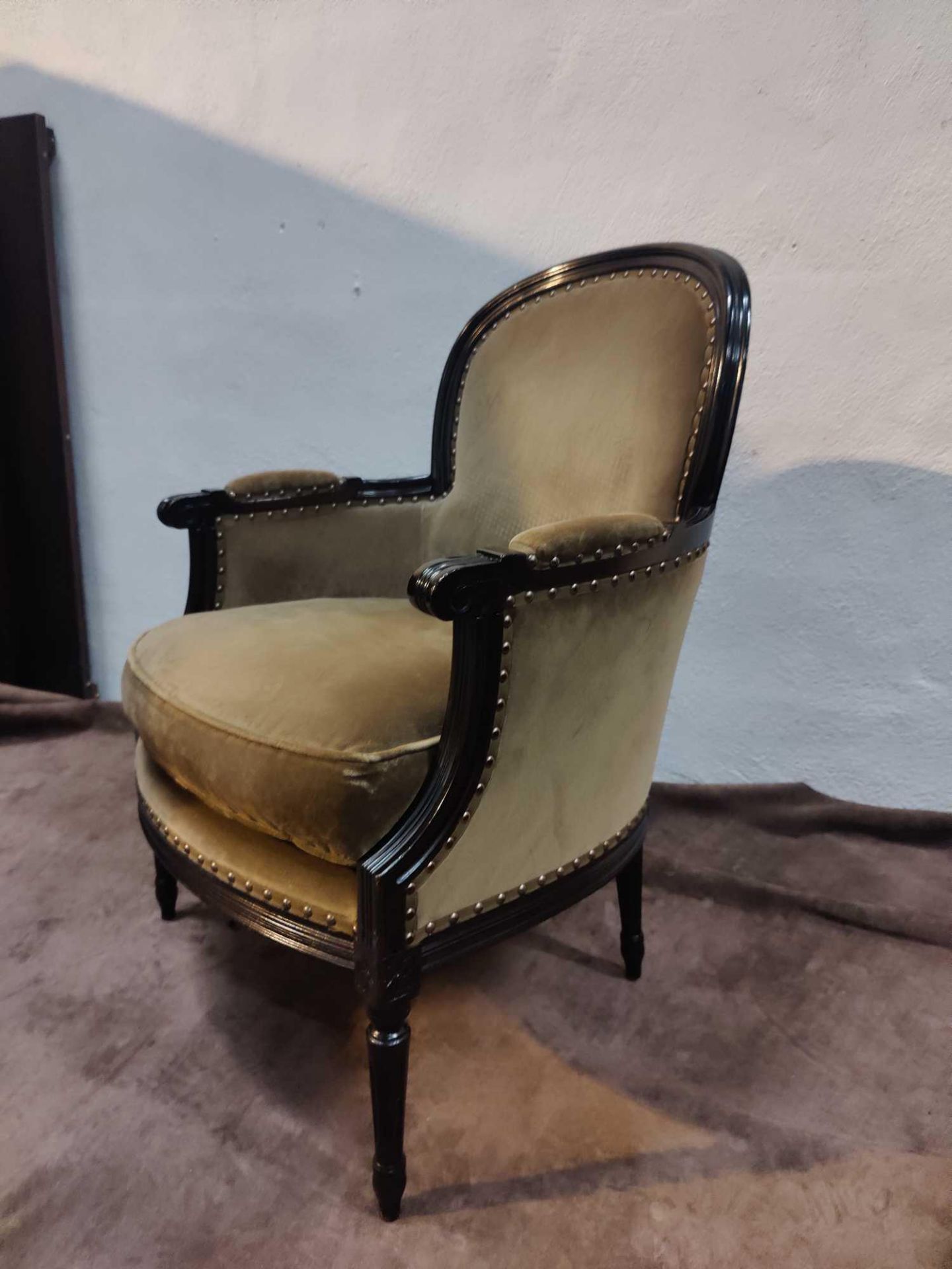 A Louis XV Style Bergere Chair In Taupe Brown With Squab Cushion The Slightly Flared Arms Have