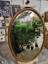 A Ovoid Wooden Decorative Framed Bevelled Mirror 65 x 95cm