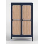 Reed Cabinet The Reed Cabinet is a black cabinet that has oak doors and solid oak framing as well as