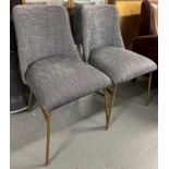 Pair Of Contemporary Dining Chairs This contemporary dining chair set features gold finish effect