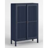 Reed Cabinet Featuring a midnight blue finish, solid oak framings, and sliding doors, the Reed