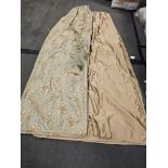 A pair of silk drapes and jabots gold with crystal trim edging and embroidered in gold silver