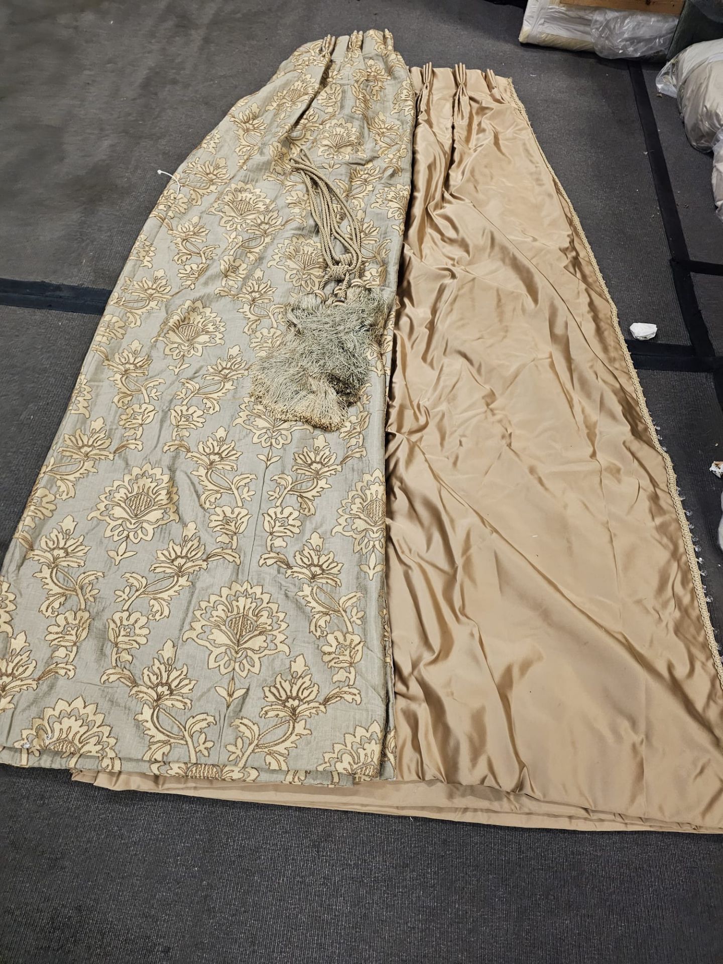 A pair of silk drapes and jabots gold with crystal trim edging and embroidered in gold silver