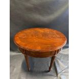 A Mahogany Ovoid Side Table The Freize Carved With Panels And Medallions Raised On Turned Fluted