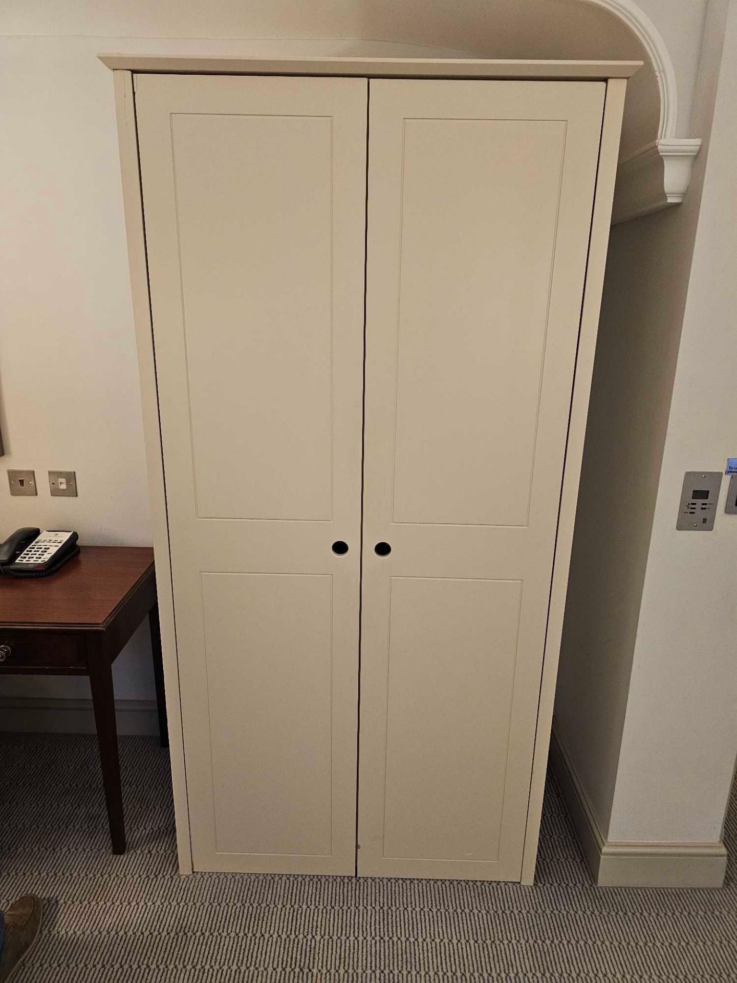 A Contemporary Two Door Wardrobe Gardenia White Finish Internally Fitted With Shelving And Chrome