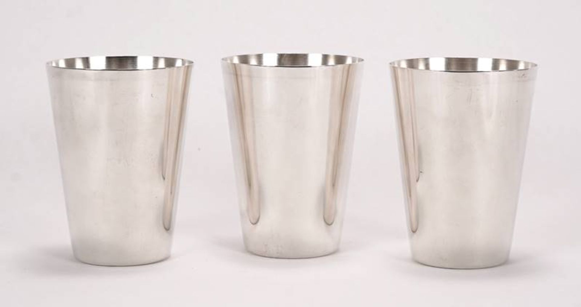 Three silver cups